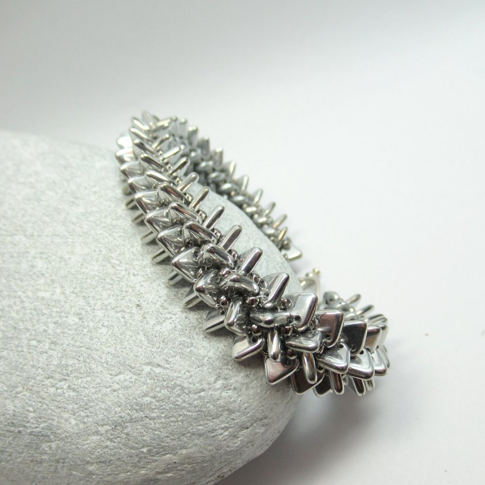 Handwoven spiky silver triangle bracelet